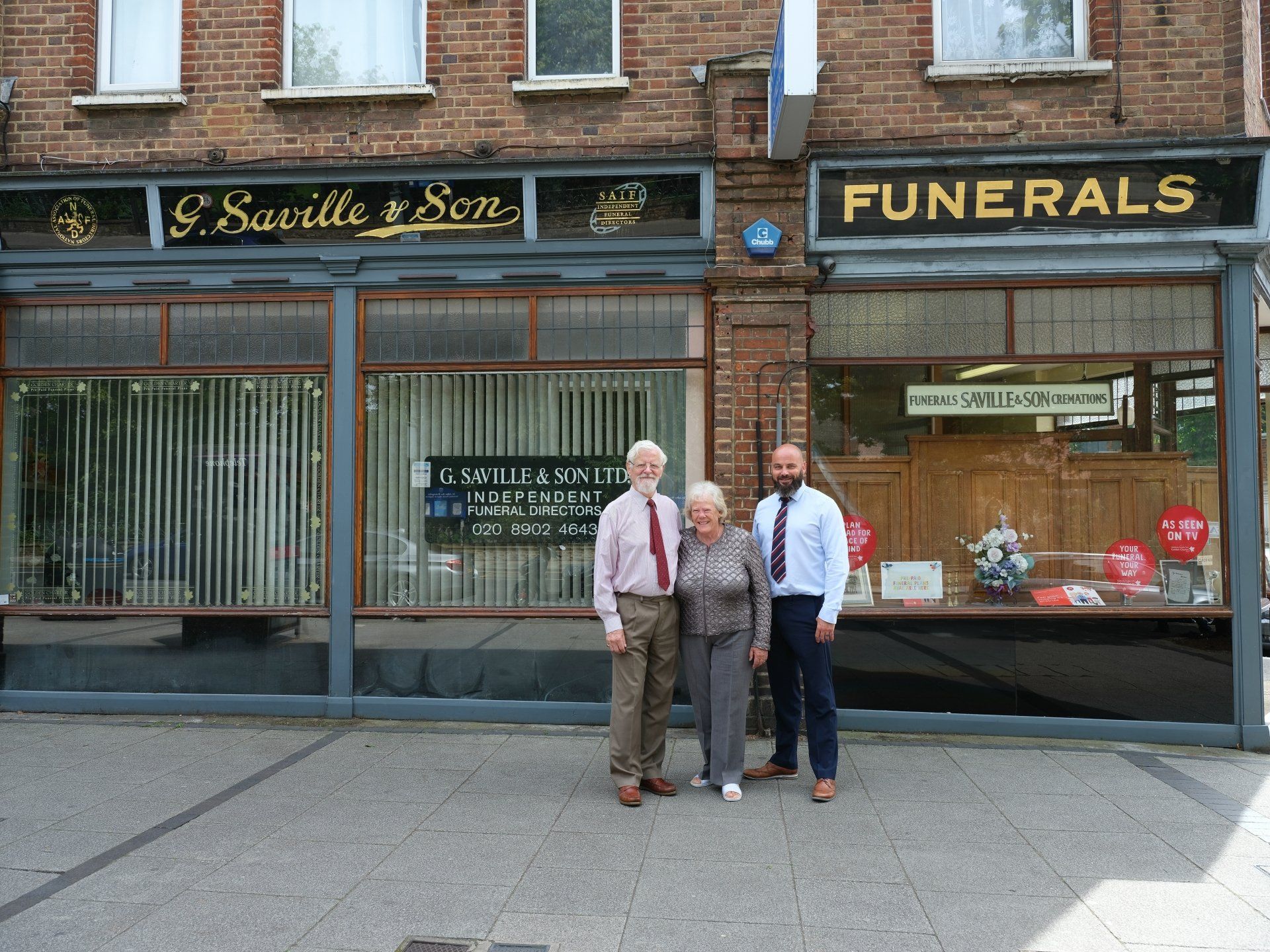 Three generations of the Saville family in front of the Wembley shop
